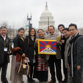 Tibet Lobby Day participants hold the "snow lion" Tibetan flag outside the Capital building.