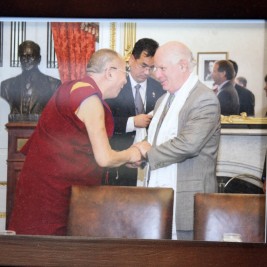 A photograph of His Holiness the Dalai Lama meeting Senator Ben Cardin (D-MD) sits framed in his office.
