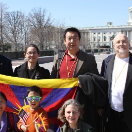Tibet Lobby Day participants from Maryland (including Jigme, the youngest Lobby Day participant) pose with the Tibetan flag outside the Capital.