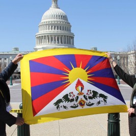 Tibet Lobby Day participants from Maryland display the Tibetan flag outside the Capital.
